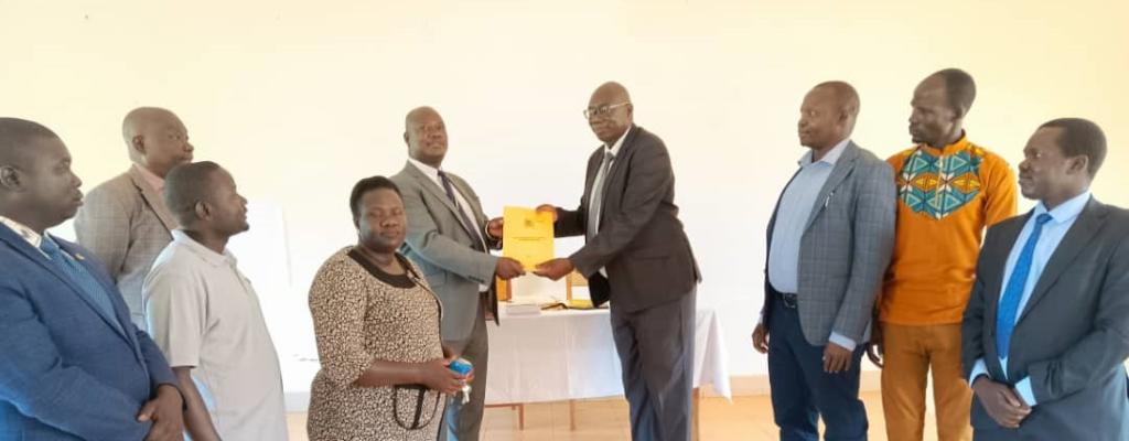 CAO'S HANDOVER/TAKEOVER: Outgoing Chief Administrative Officer Mr. Bedijo James Okumu handing over office to Incoming Chief Administrative Officer Mr. Obong Thomson at the District Council Hall.