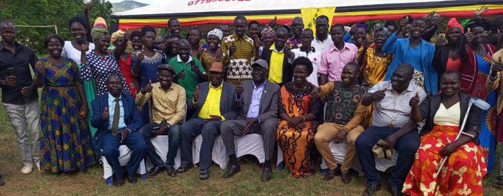 Launch of Parish Development Cash Transfers by Minister for Relief, Disaster Preparedness and Refugees - Hon. Hillary Obaloker Onek (Centre) at Lokung Trading Centre.